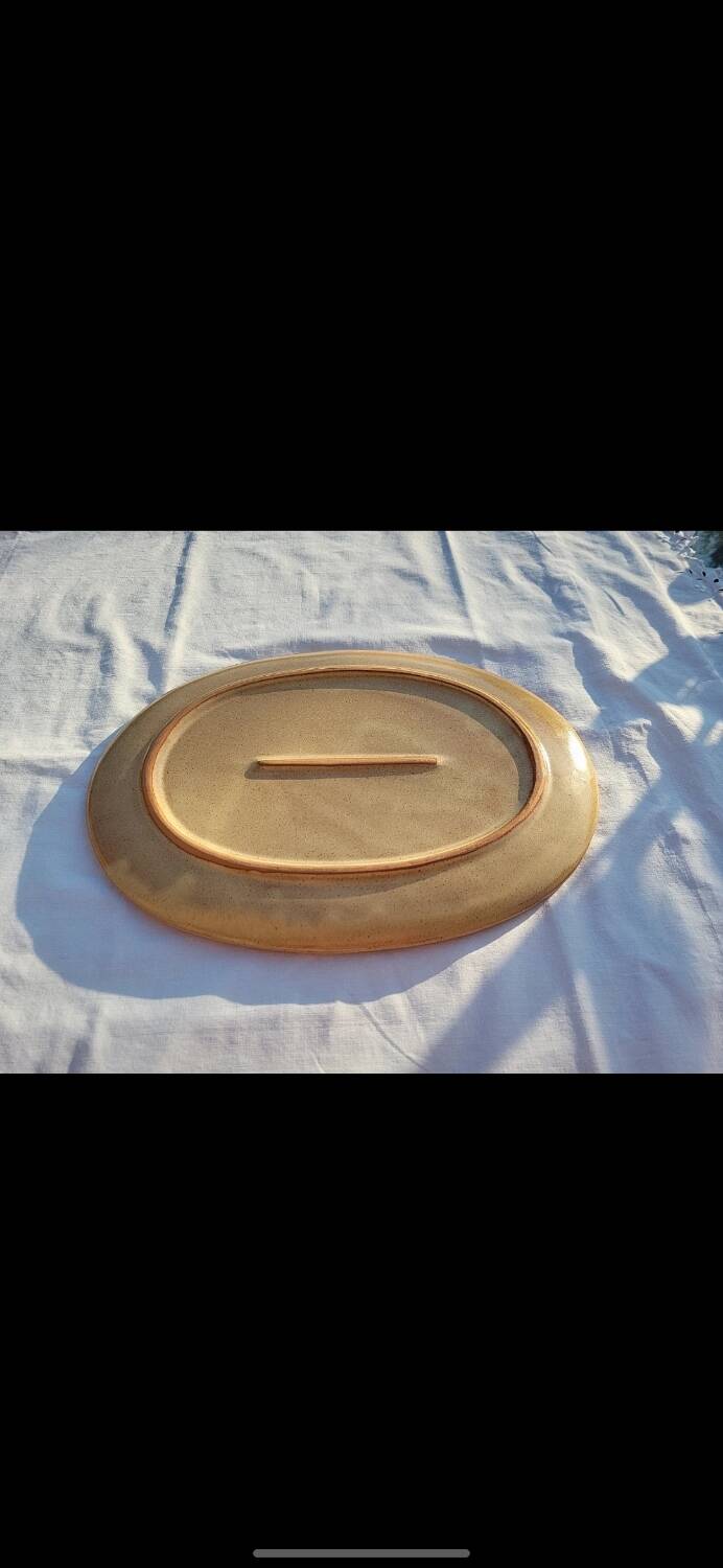 Oval dish in speckled enamelled stoneware