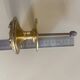 Entrance door pull handle in solid brass