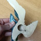 Two exotic birds in slip to hang