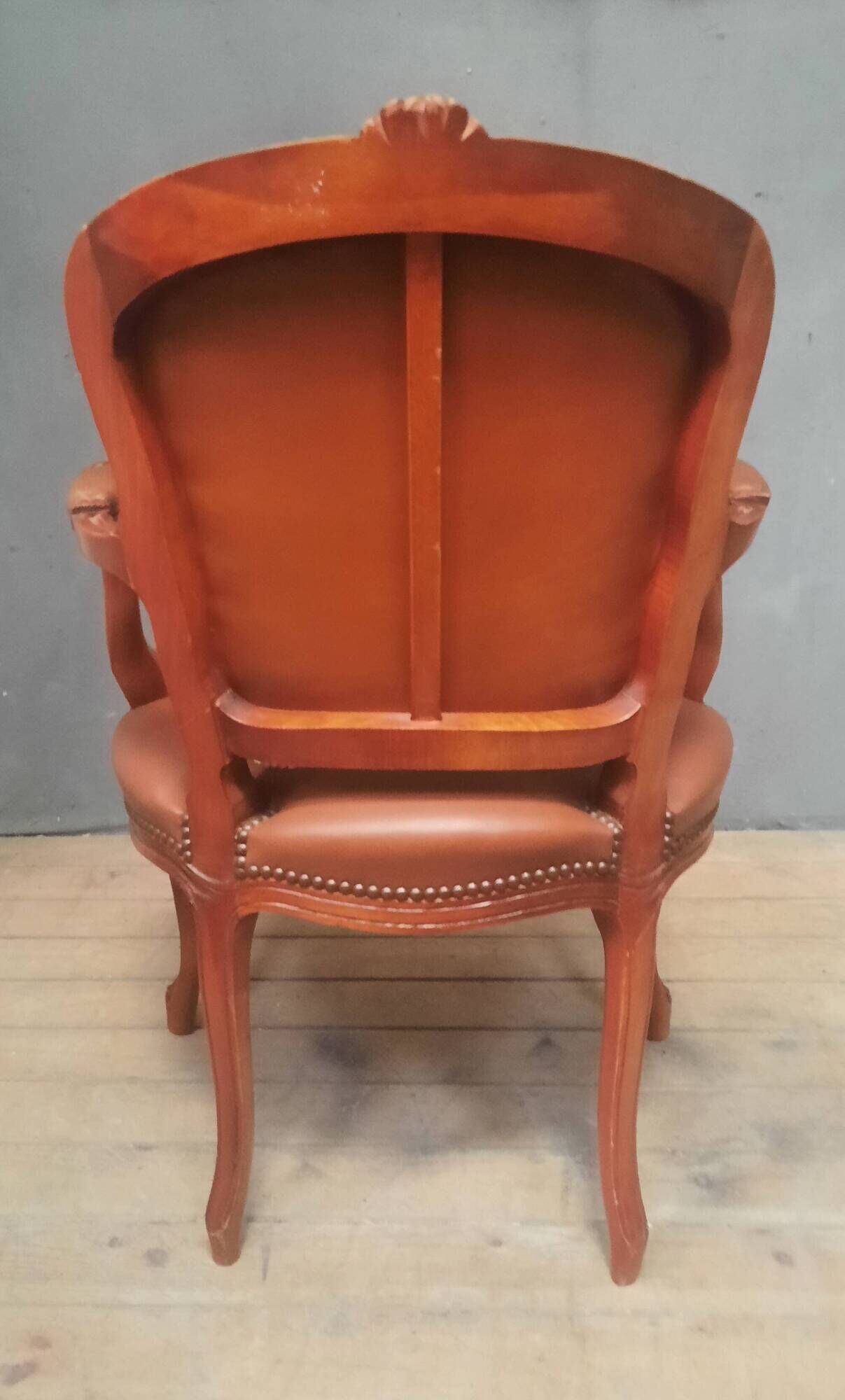 Louis XV style armchair covered in leather.