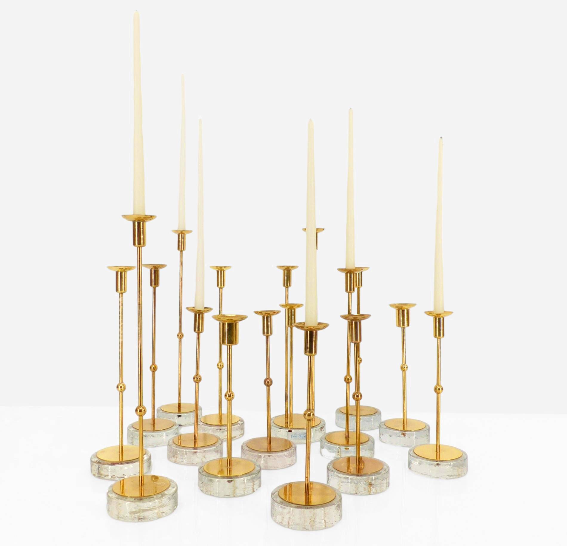 Set of 15 Scandinavian candle holders in brass and glass, Gunnar Ander, Ystad Met