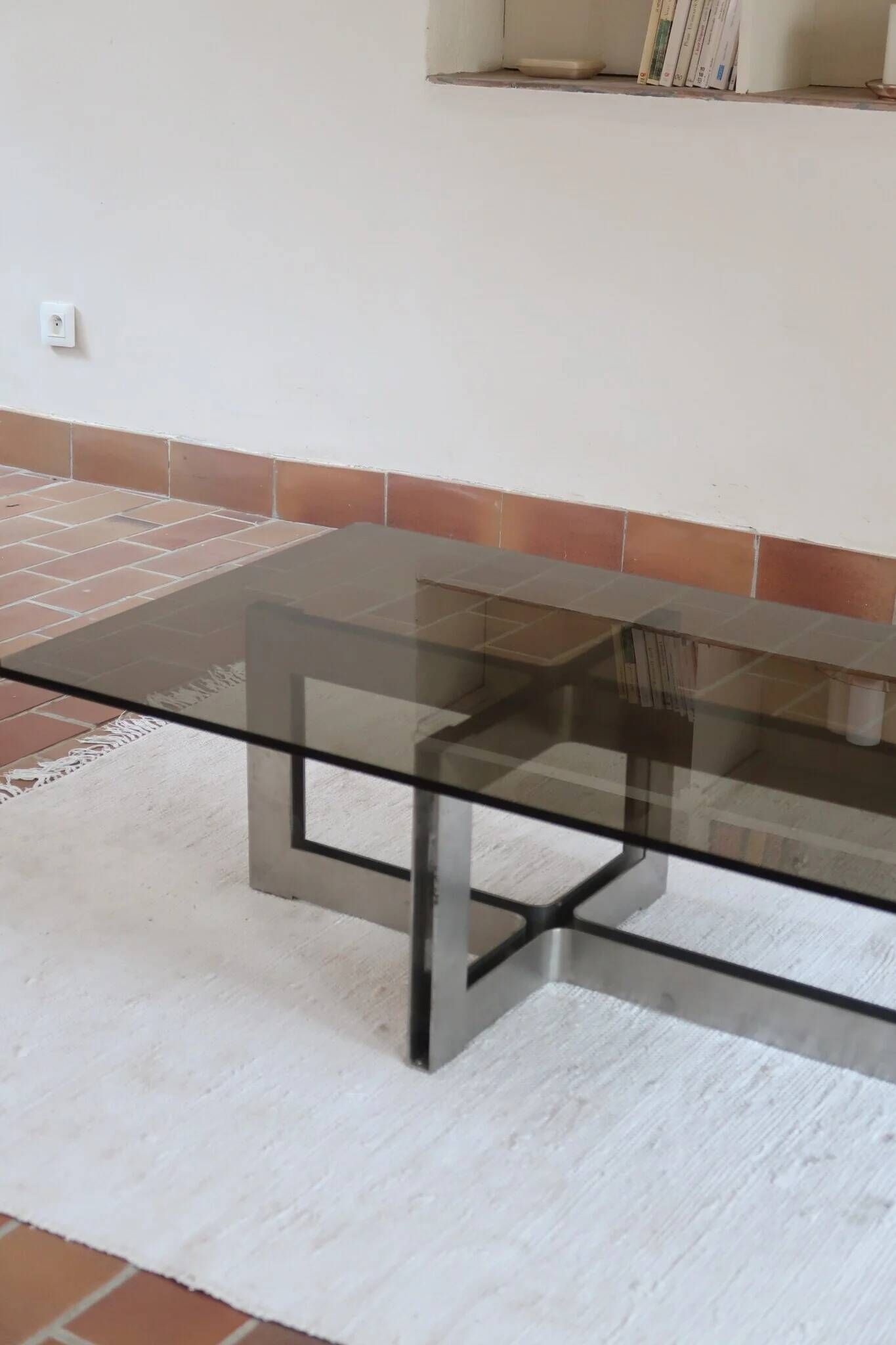 Smoked glass coffee table, brushed stainless steel base, 1970s.