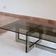 Smoked glass coffee table, brushed stainless steel base, 1970s.