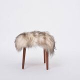 Danish Mid-century Modern stool reupholstered in white and black sheep skin