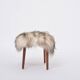 Danish Mid-century Modern stool reupholstered in white and black sheep skin