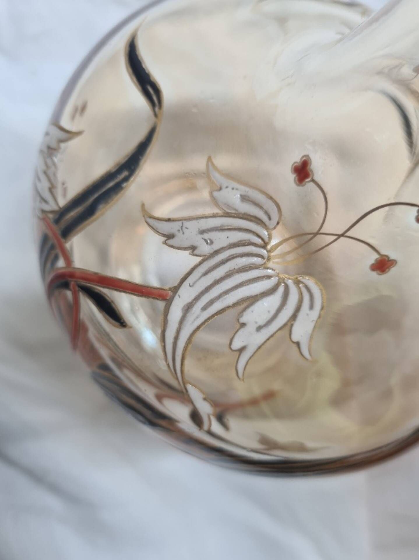 Large Art Nouveau carafe with iridescent enamelled glass and flowers.