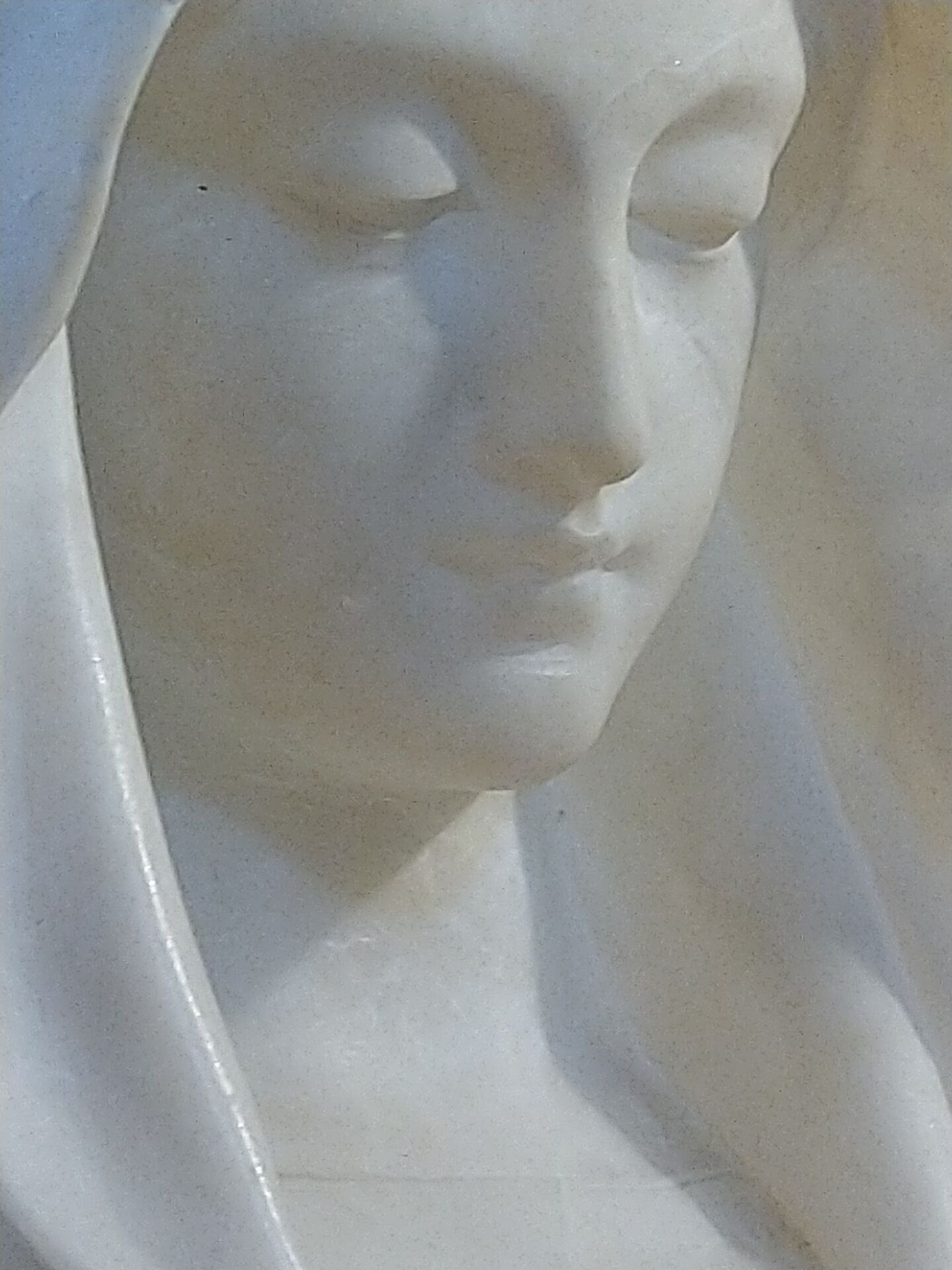 Bust of the Virgin in alabaster by Guglielmo Pugi.