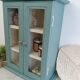 Green and beige 2-door wall display case