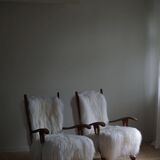Pair of Scandinavian armchairs in oak and long-haired Icelandic sheepskin by Henning Kjærnulf, 1950.
