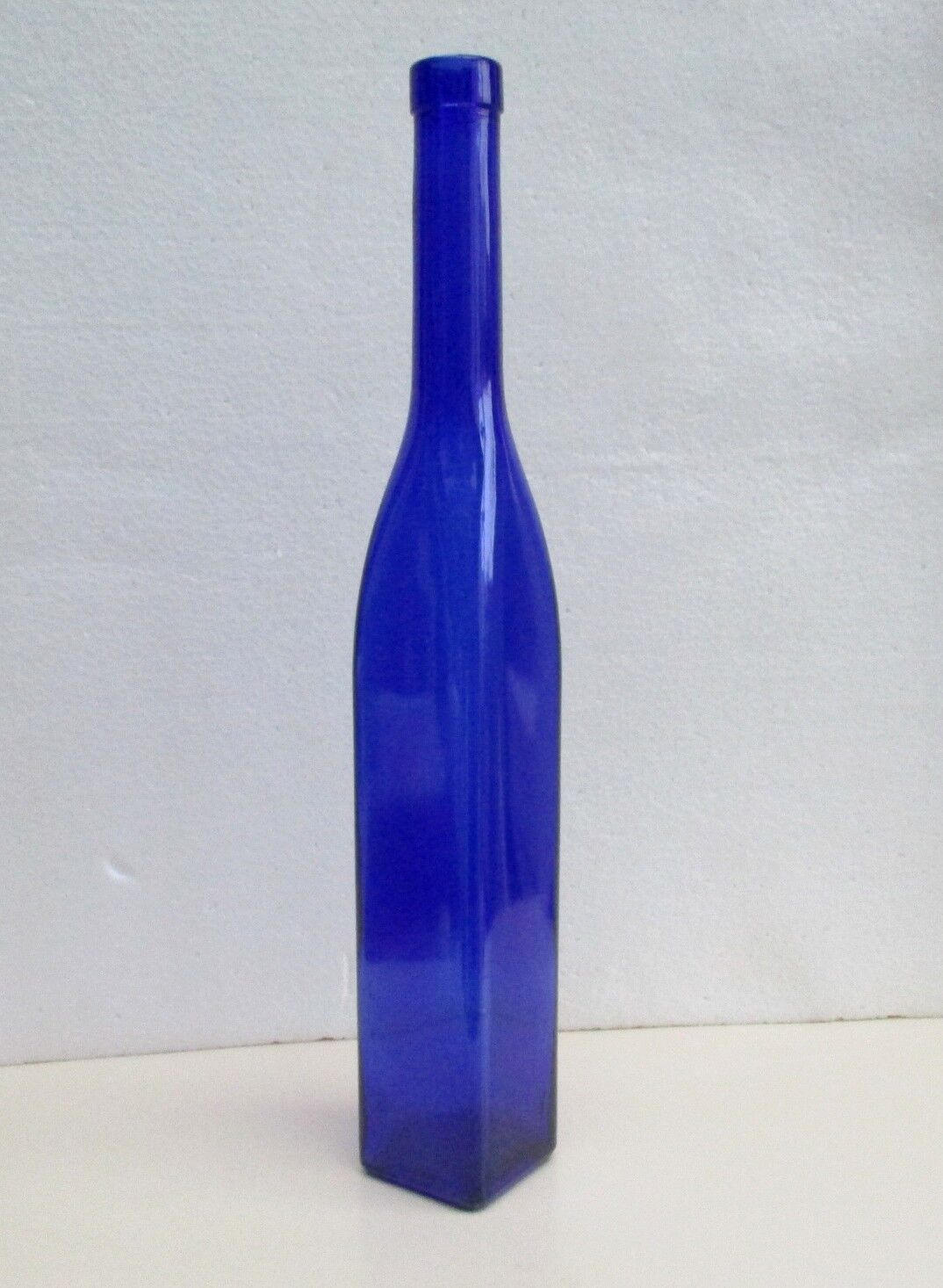 Blue glass bottle, square
