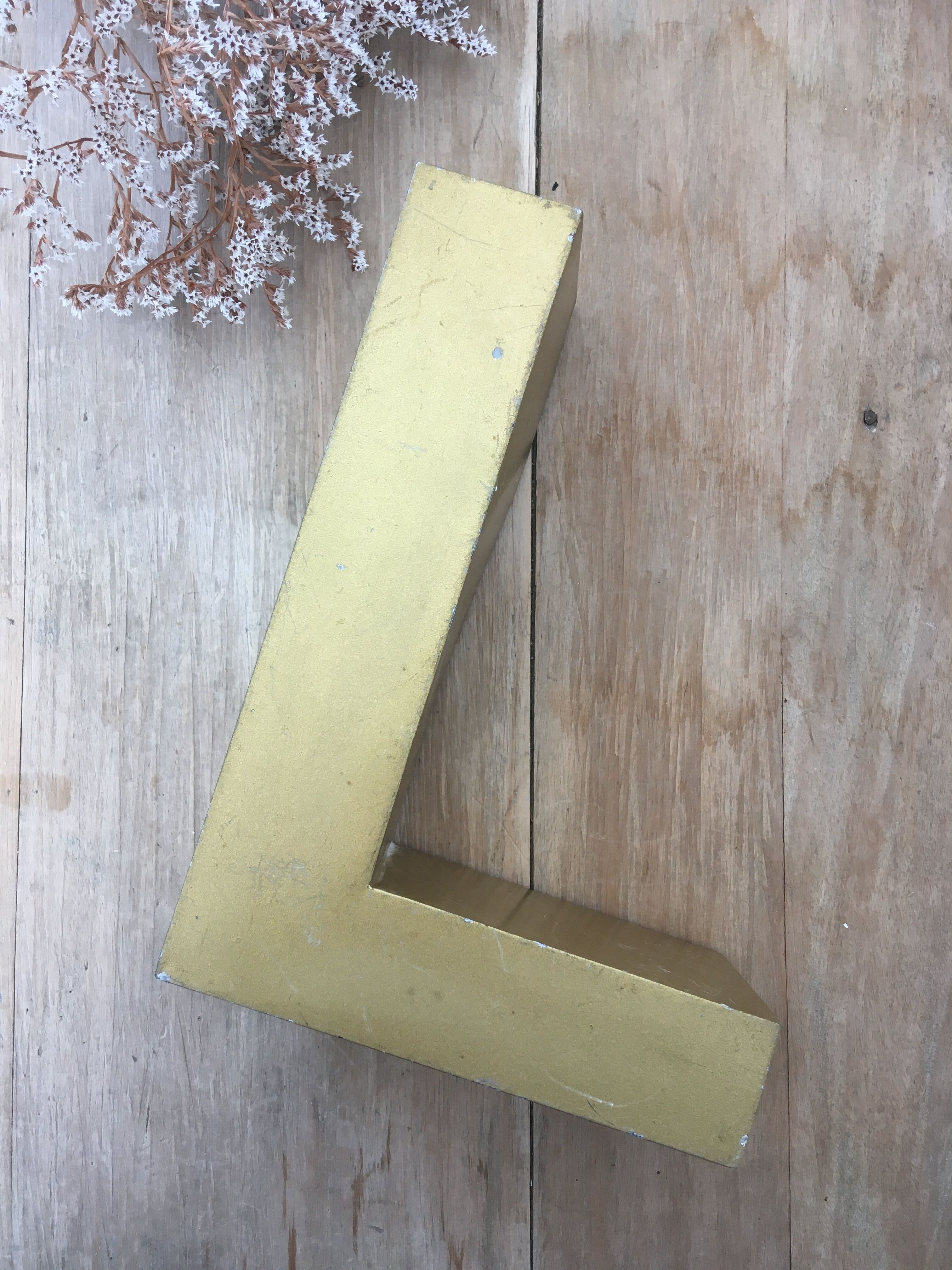 Golden vintage sign letter L