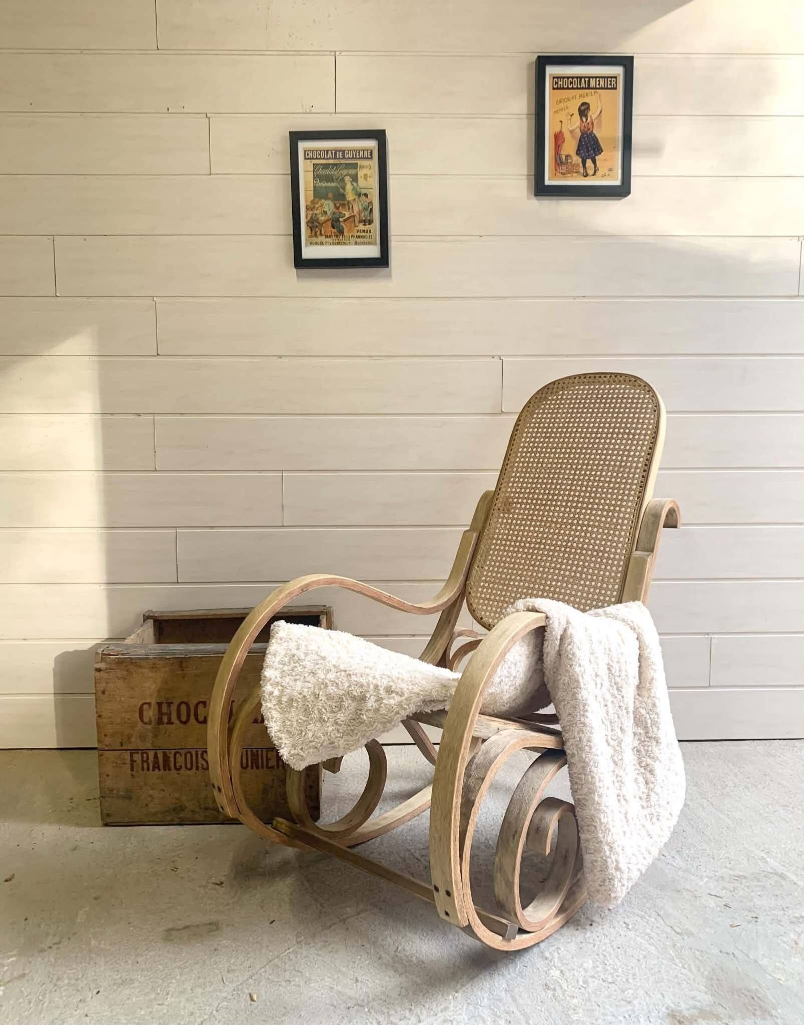 Rocking chair with a cane seat and backrest.