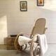 Rocking chair with a cane seat and backrest.