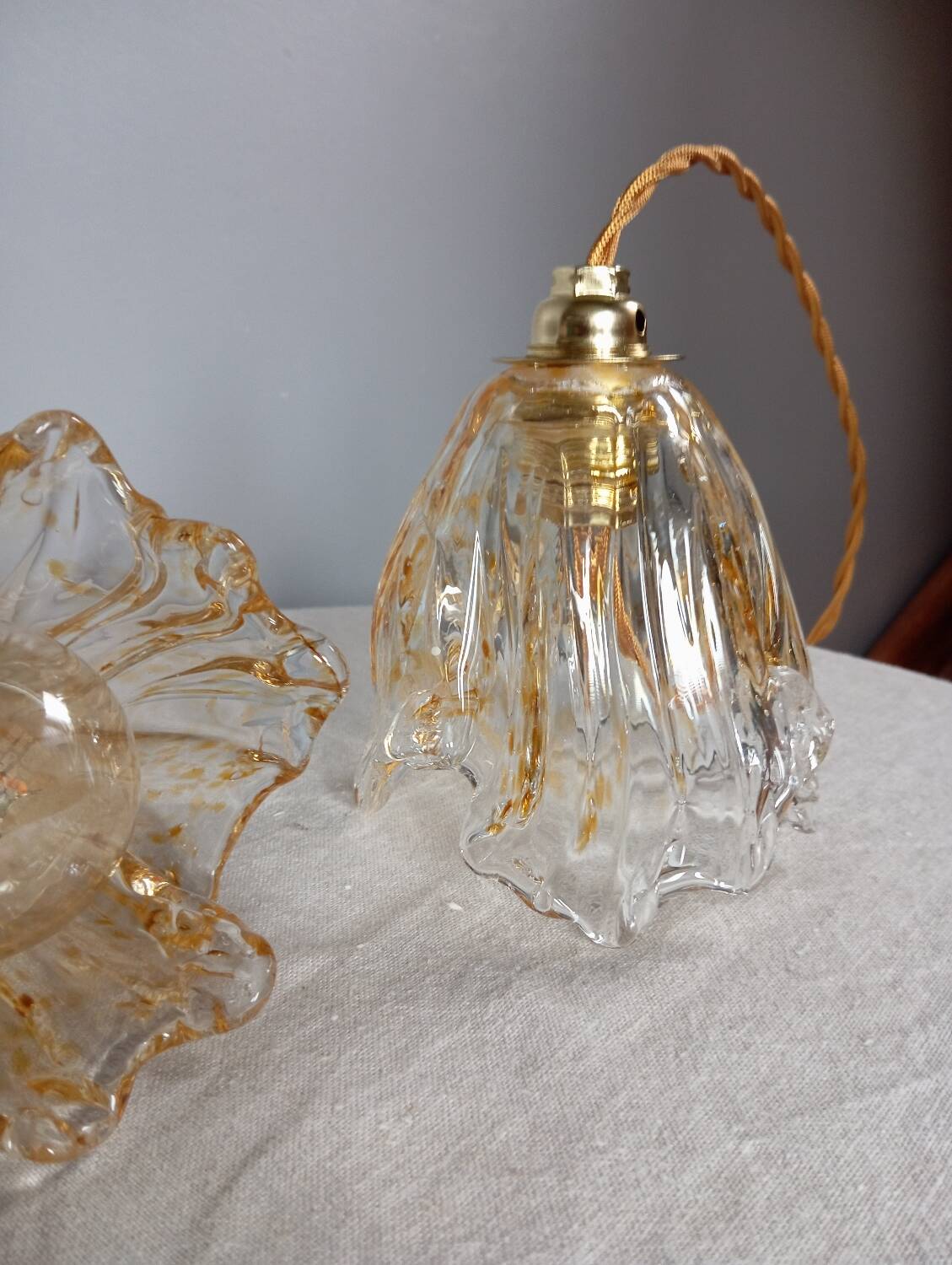 Pair of draped blown glass hanging lamps, ocher twisted wire