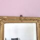 Richly carved antique gilded mirror