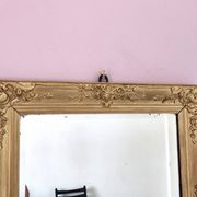 Miroir ancien doré richement sculpté
