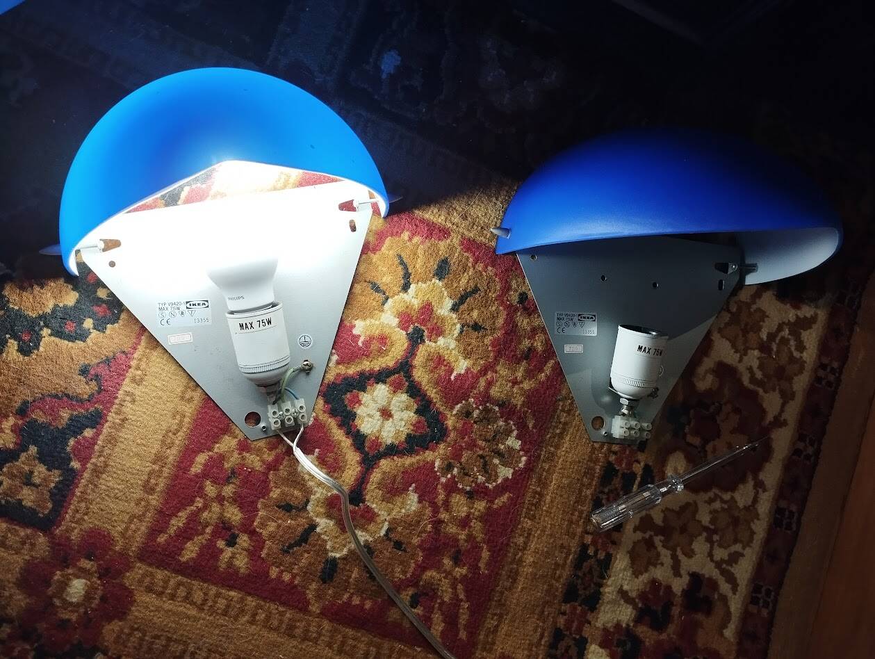 a pair of Ikea Kvintett wall lamps