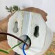 Swan neck wall light in ceramic with an opaline white glass globe.