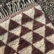 Very large Moroccan Berber rug in cream and burgundy 450x300 cm with a triangular pattern.