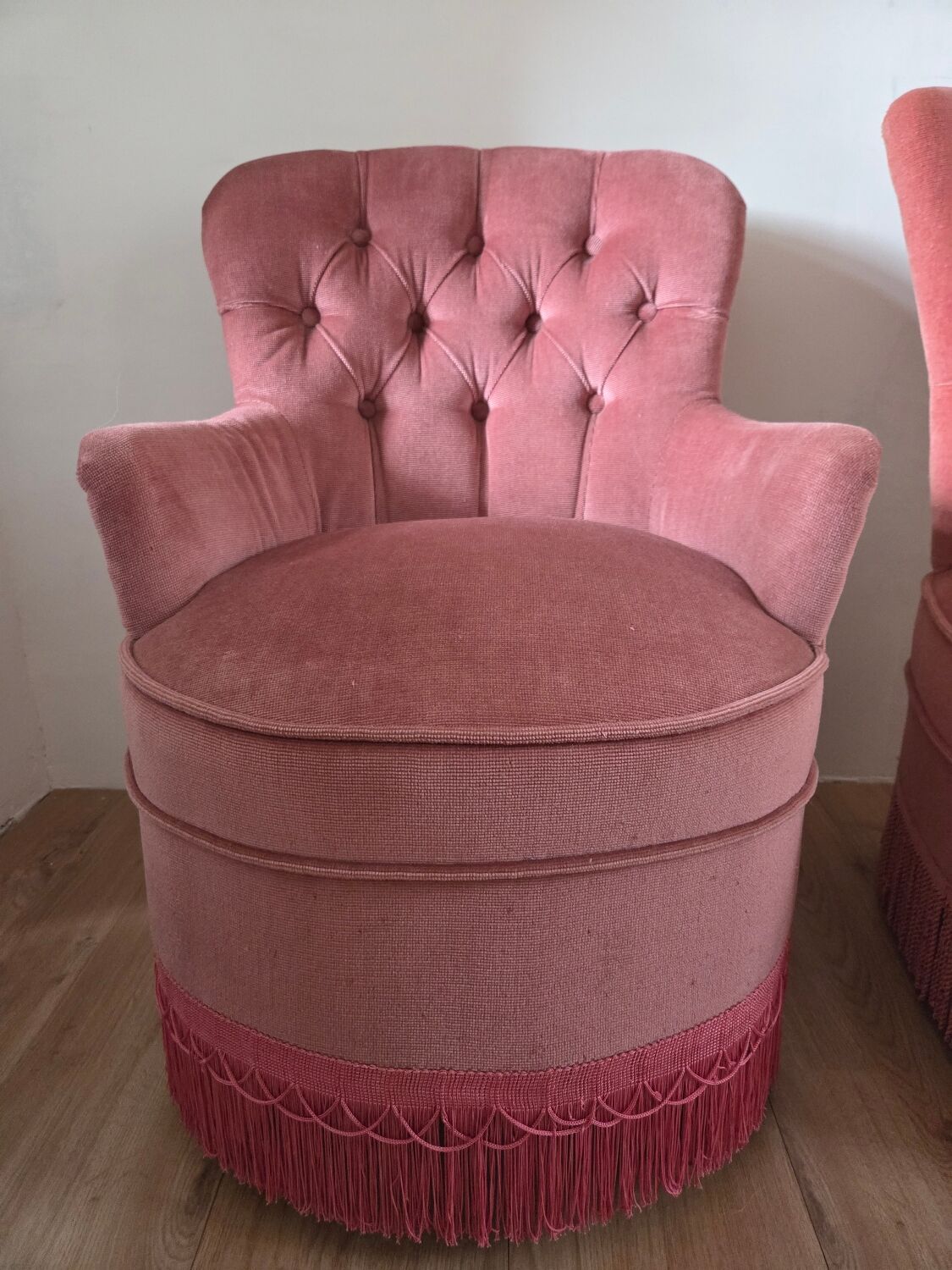 A pair of small tub chairs.