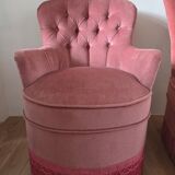 A pair of small tub chairs.