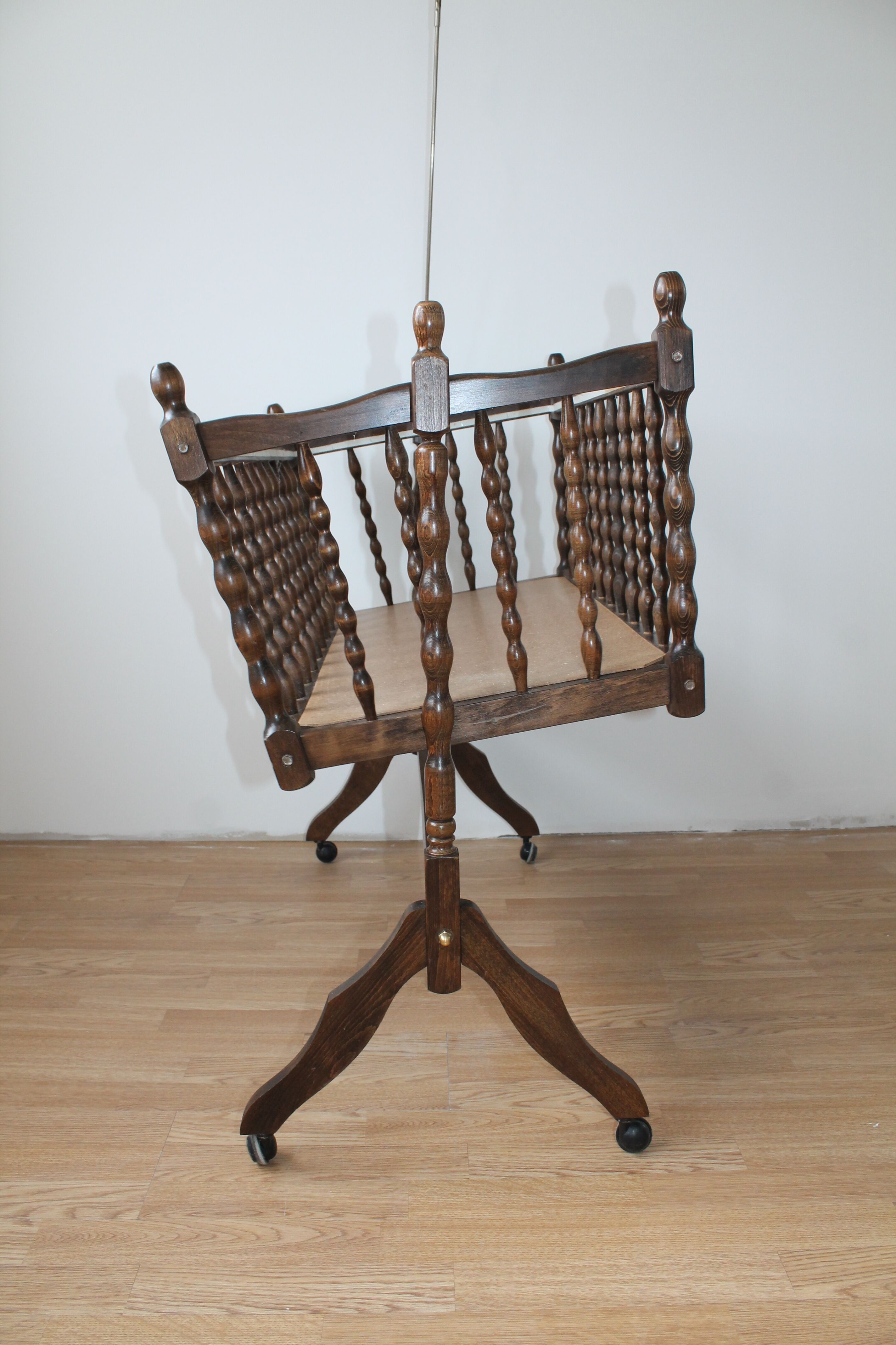 Old Vintage cradle with balance on wheels