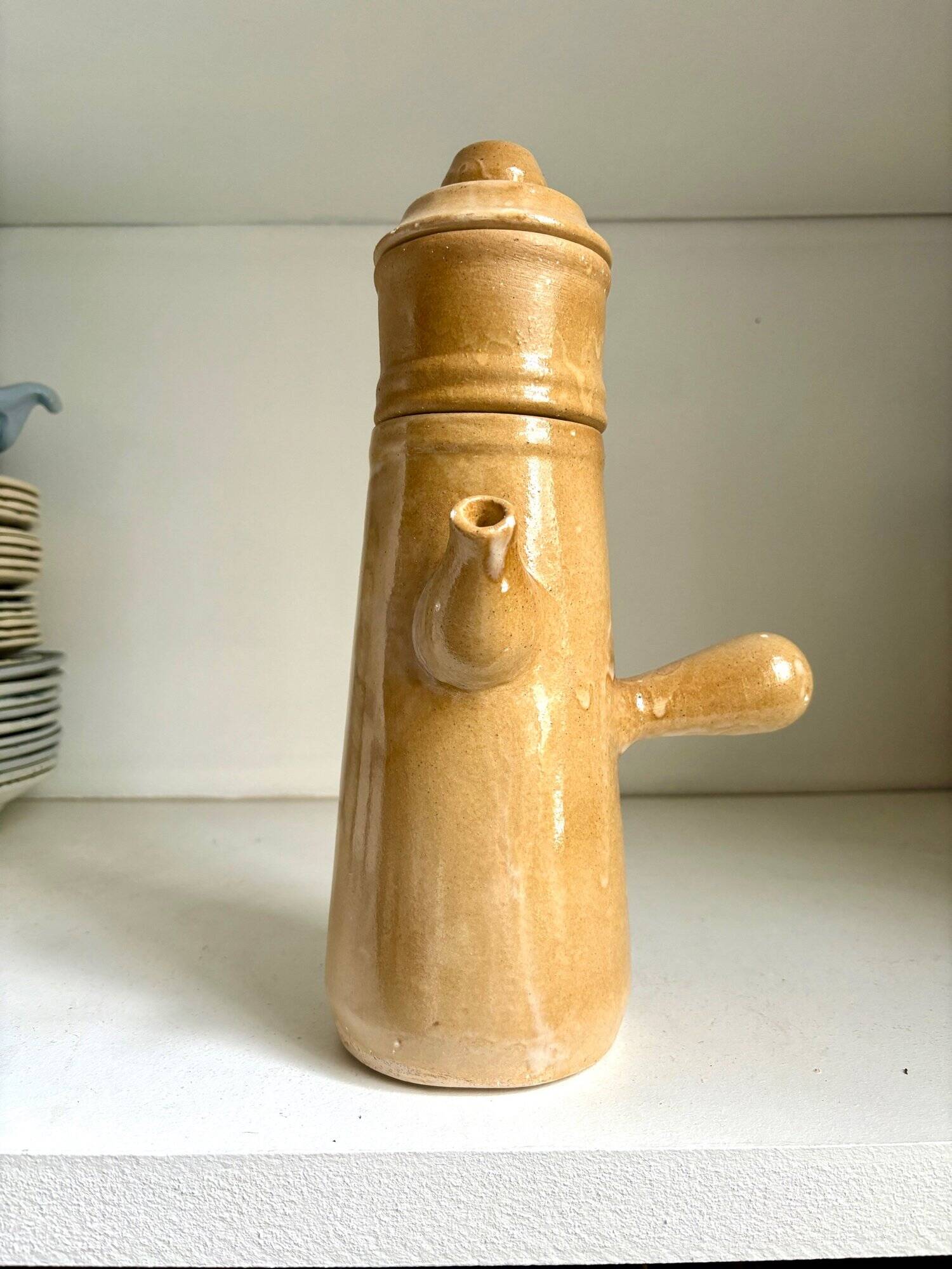 Beige enameled stoneware teapot