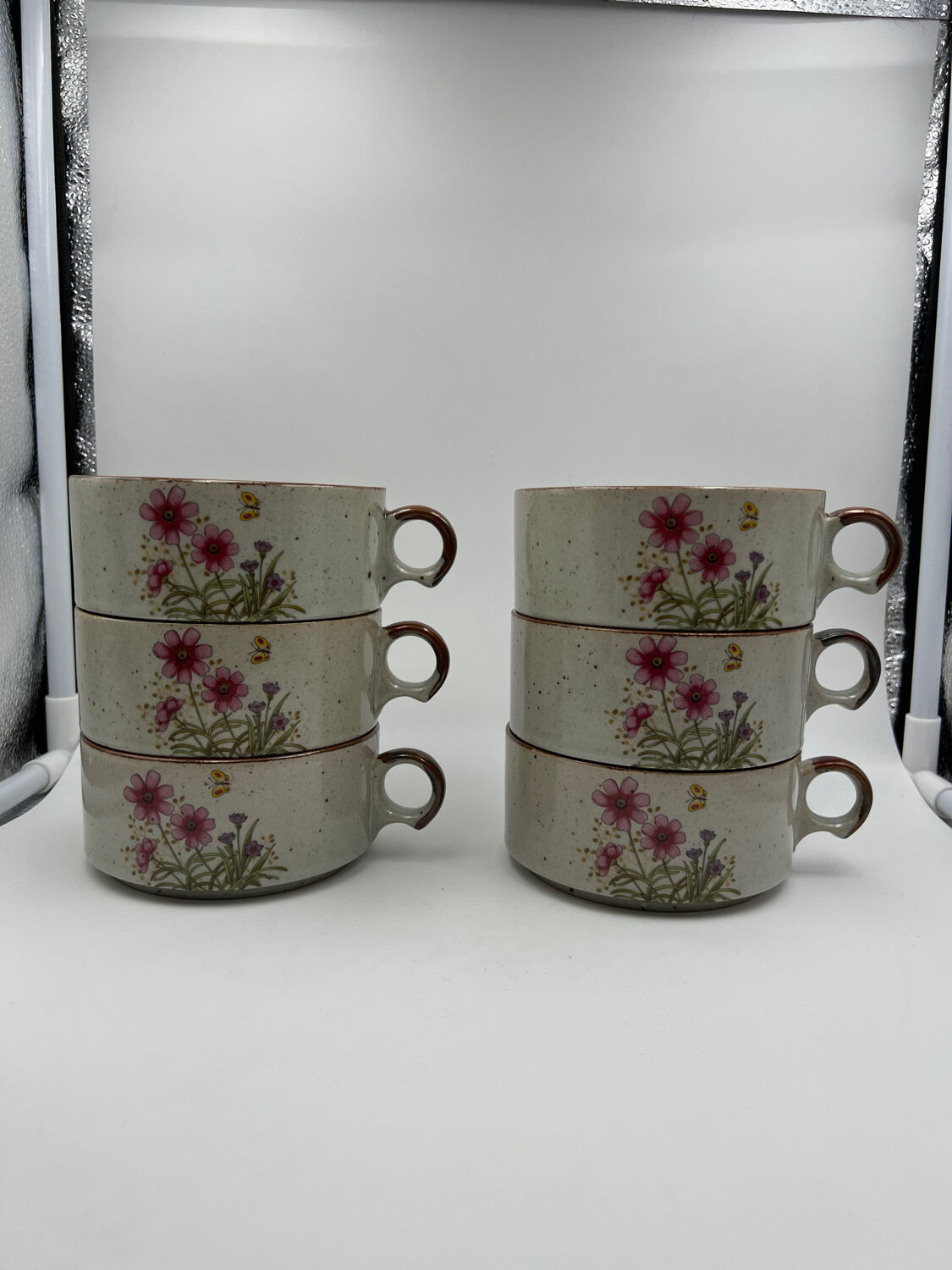 Six ceramic floral cups