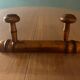 Old wooden coat rack with 2 hooks