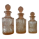 Set of 3 vintage pink glass bottles with corks.