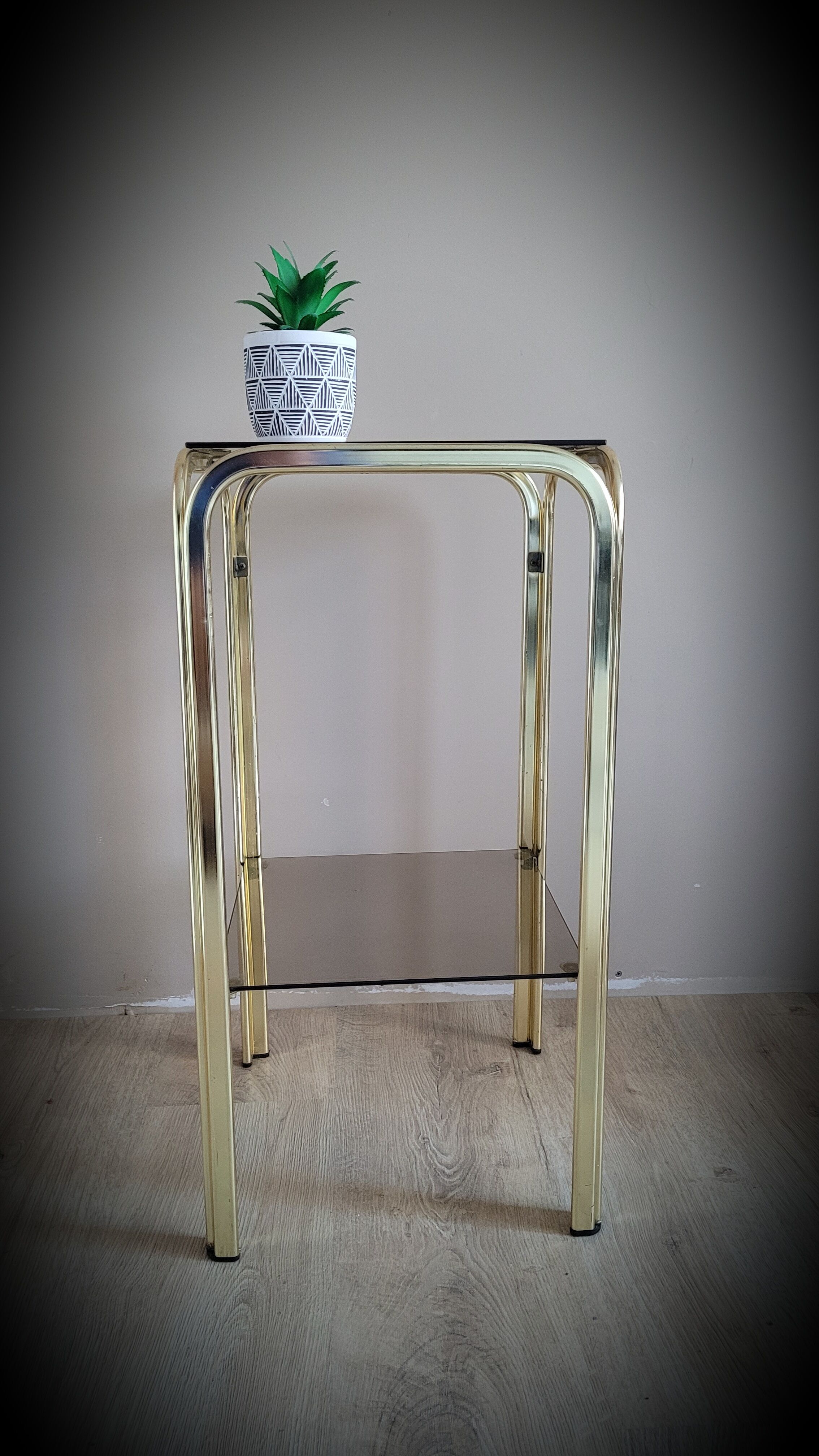 Golden side table and smoked glass