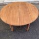 Round extendable banquet table stripped in solid mahogany with 4 extensions, 19th century.