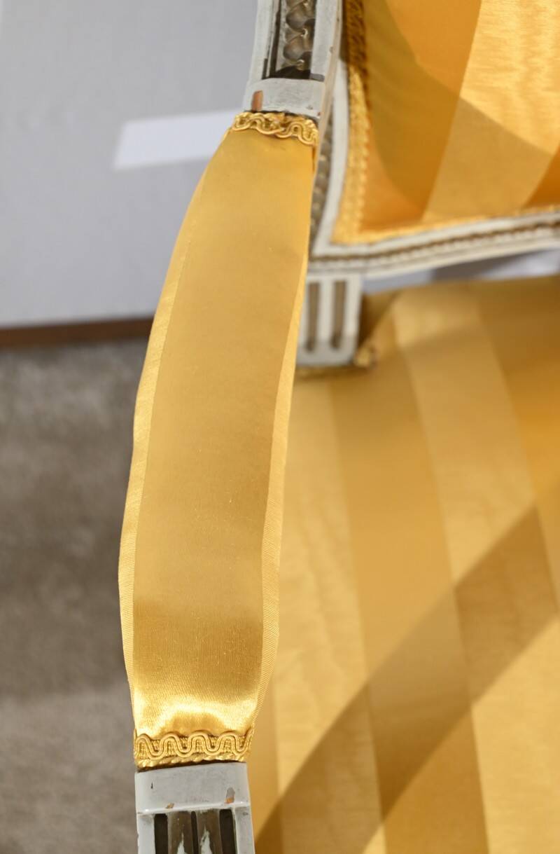 Pair of Cabriolet Armchairs, in rechampi wood, Louis XVI style – Late 19th century