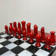Chess set with ceramic board and pieces.