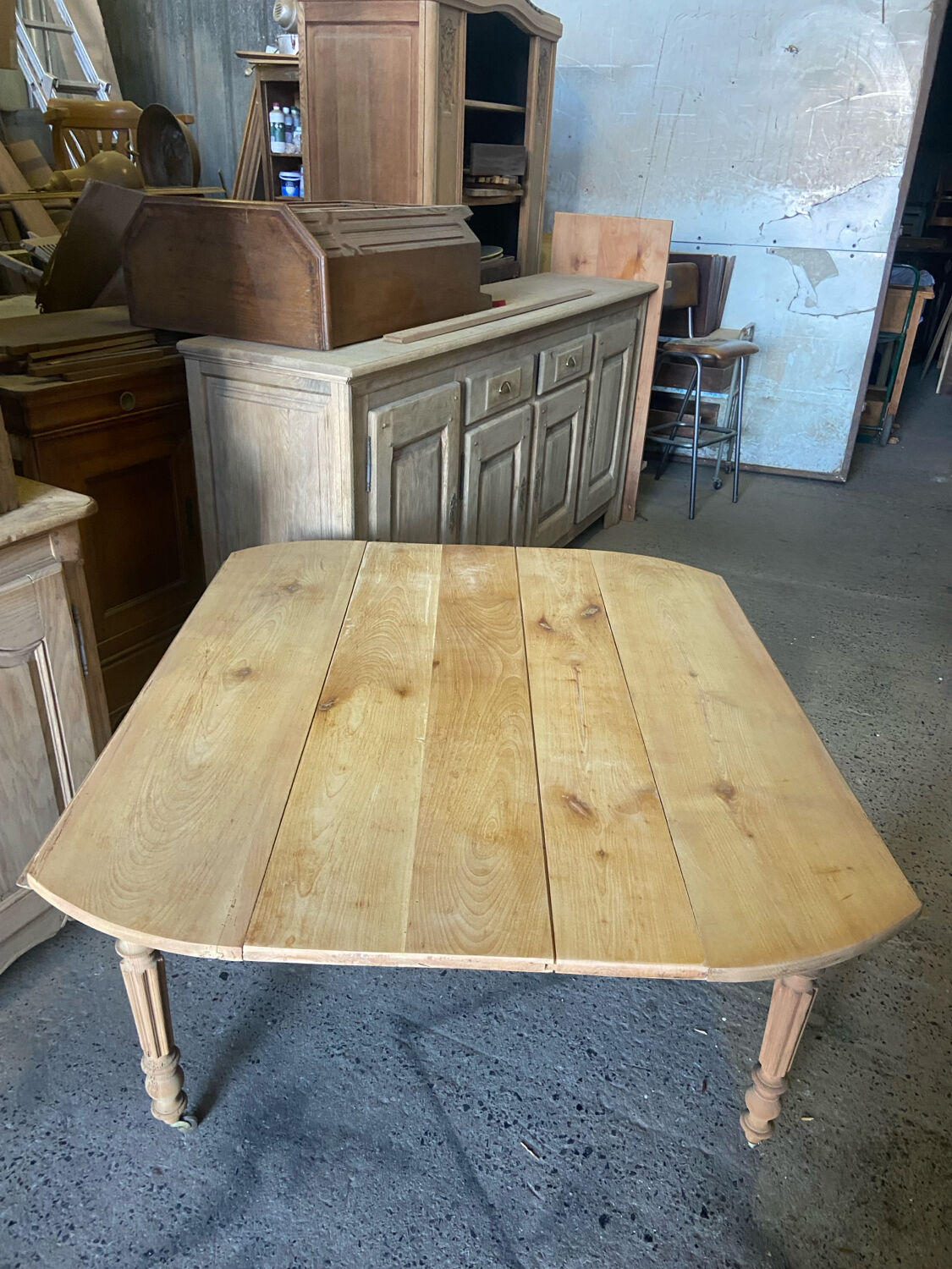 Oval wooden table on wheels.