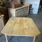 Oval wooden table on wheels.