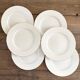 White and gold porcelain dinner plates