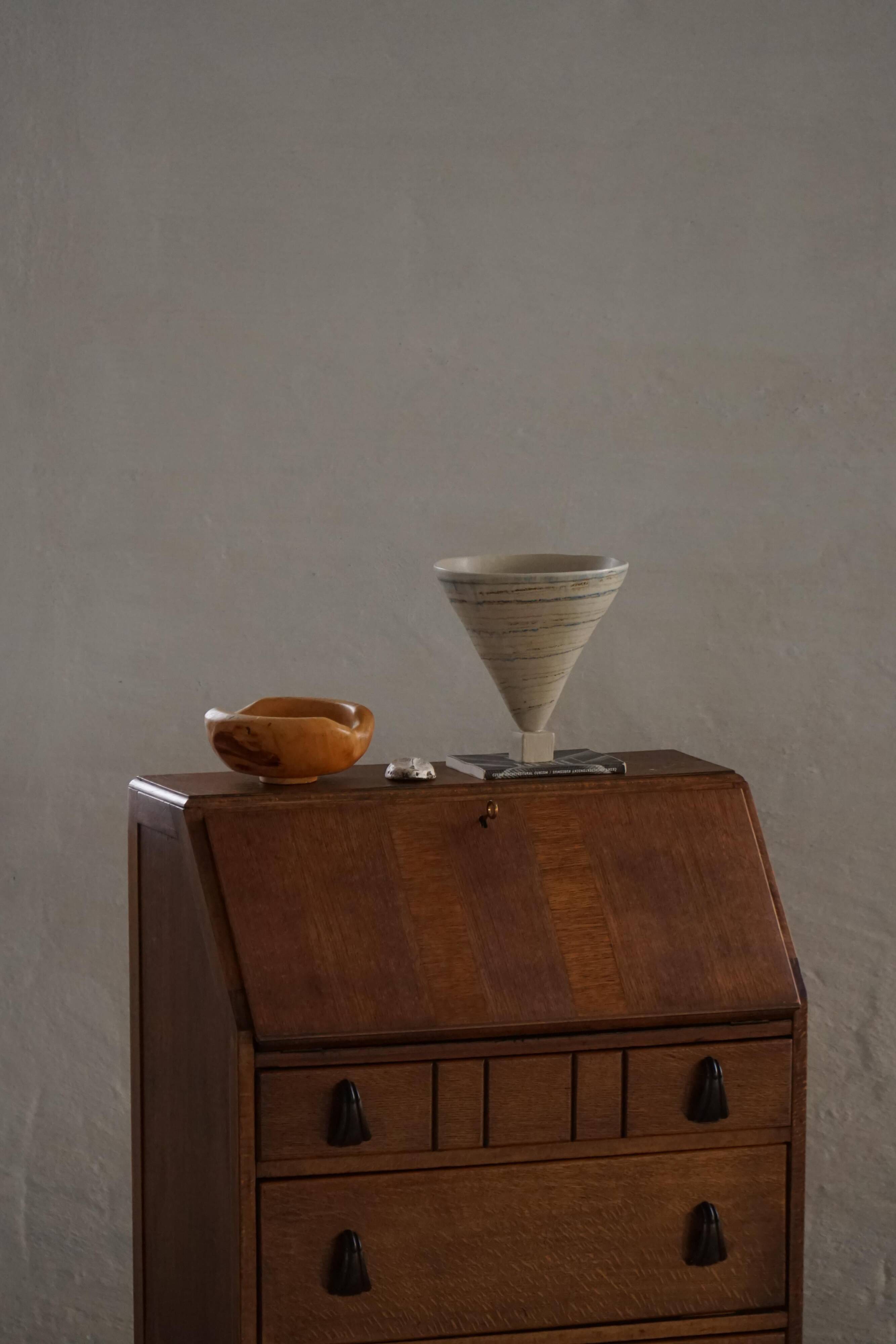 Desk / Chest of drawers in modern Danish oak from the early 20th century with shell handles.