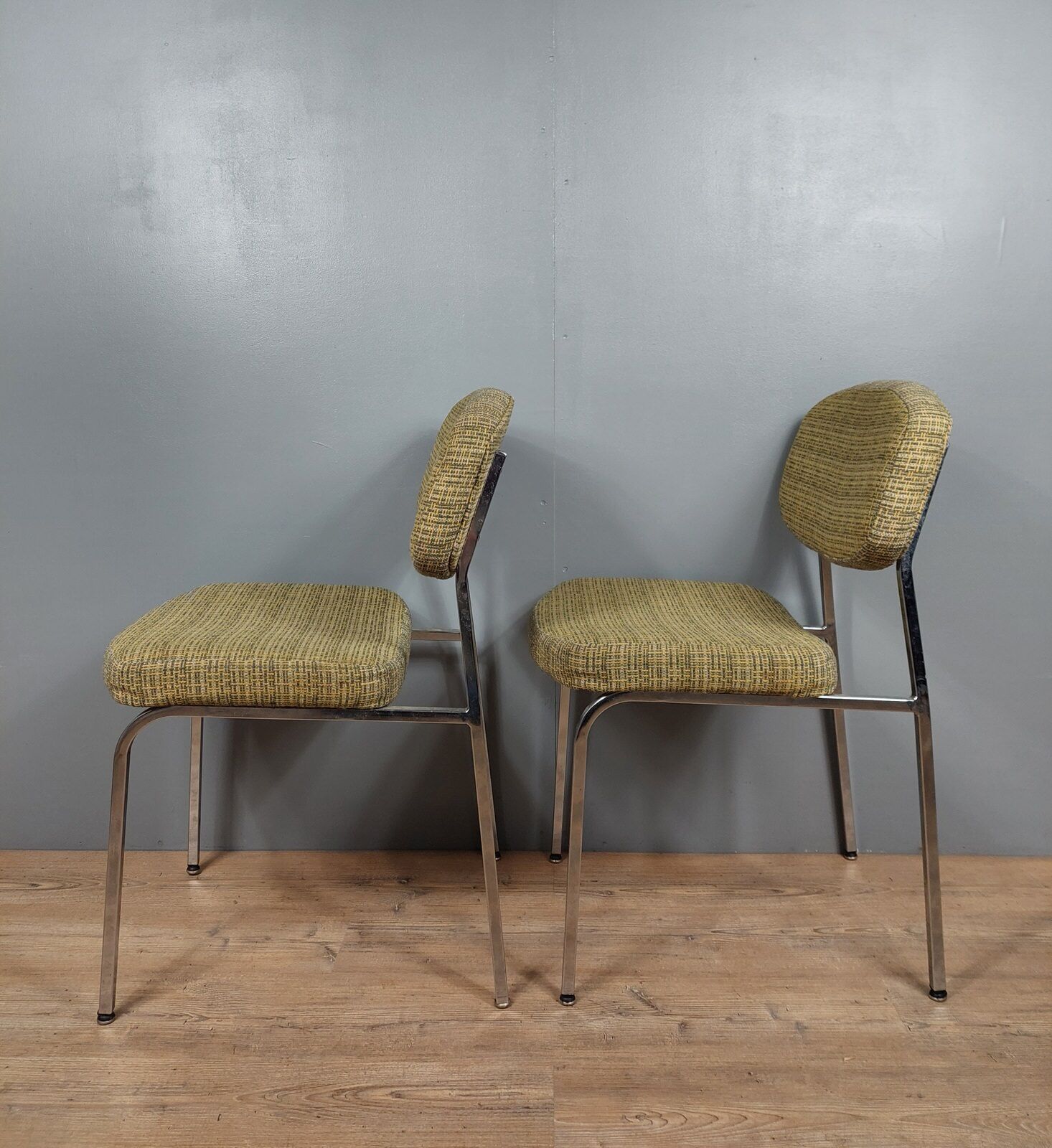 Pair of vintage chairs in fabrics and metal