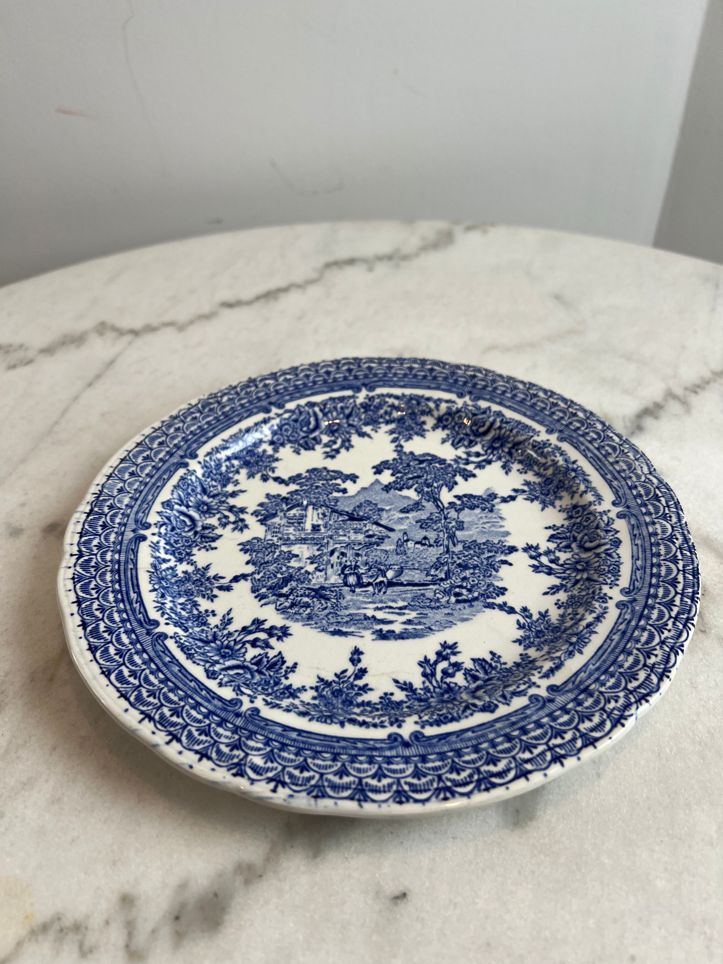 Set of four flat plates from English earthenware.