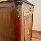 Antique bedside table in wood and marble – adorned with gilded brass ornaments –