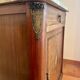 Antique bedside table in wood and marble – adorned with gilded brass ornaments –