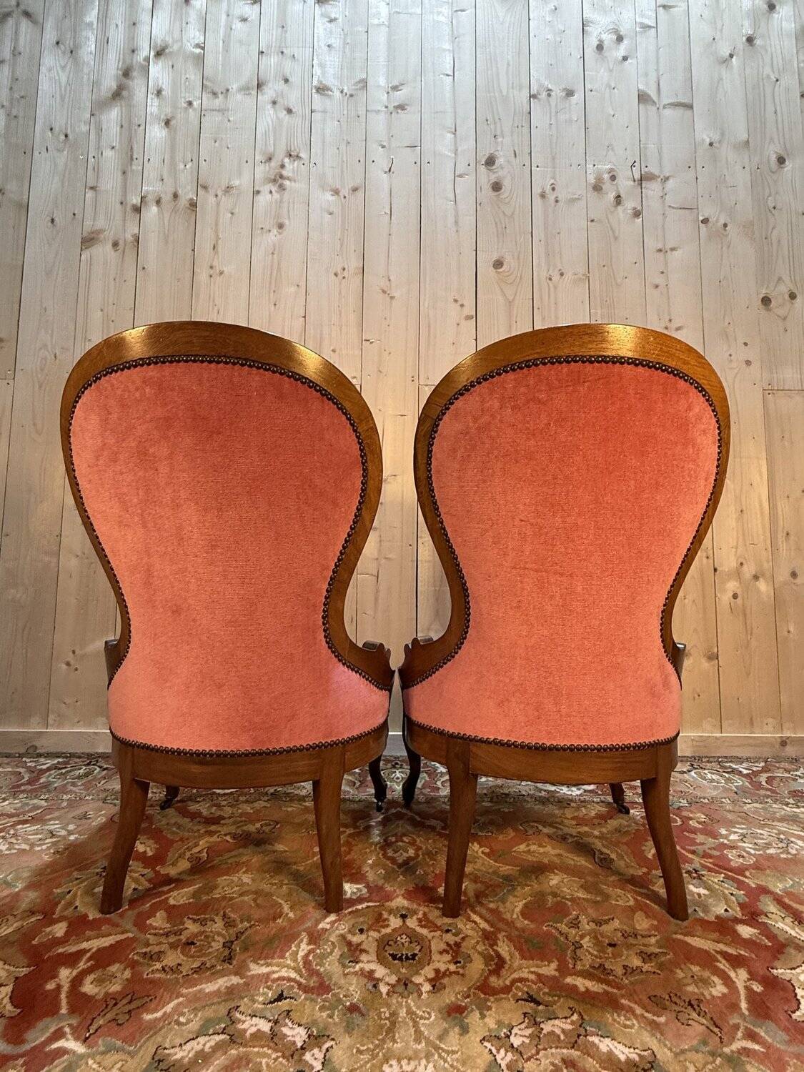Pair of Louis Philippe armchairs in walnut and pink velvet.