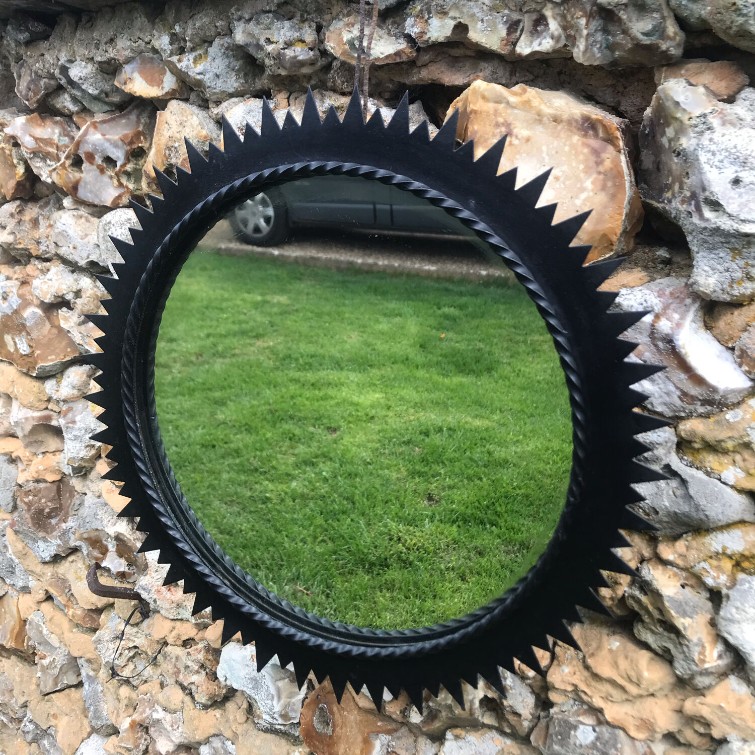 Vintage black metal sun mirror 1960