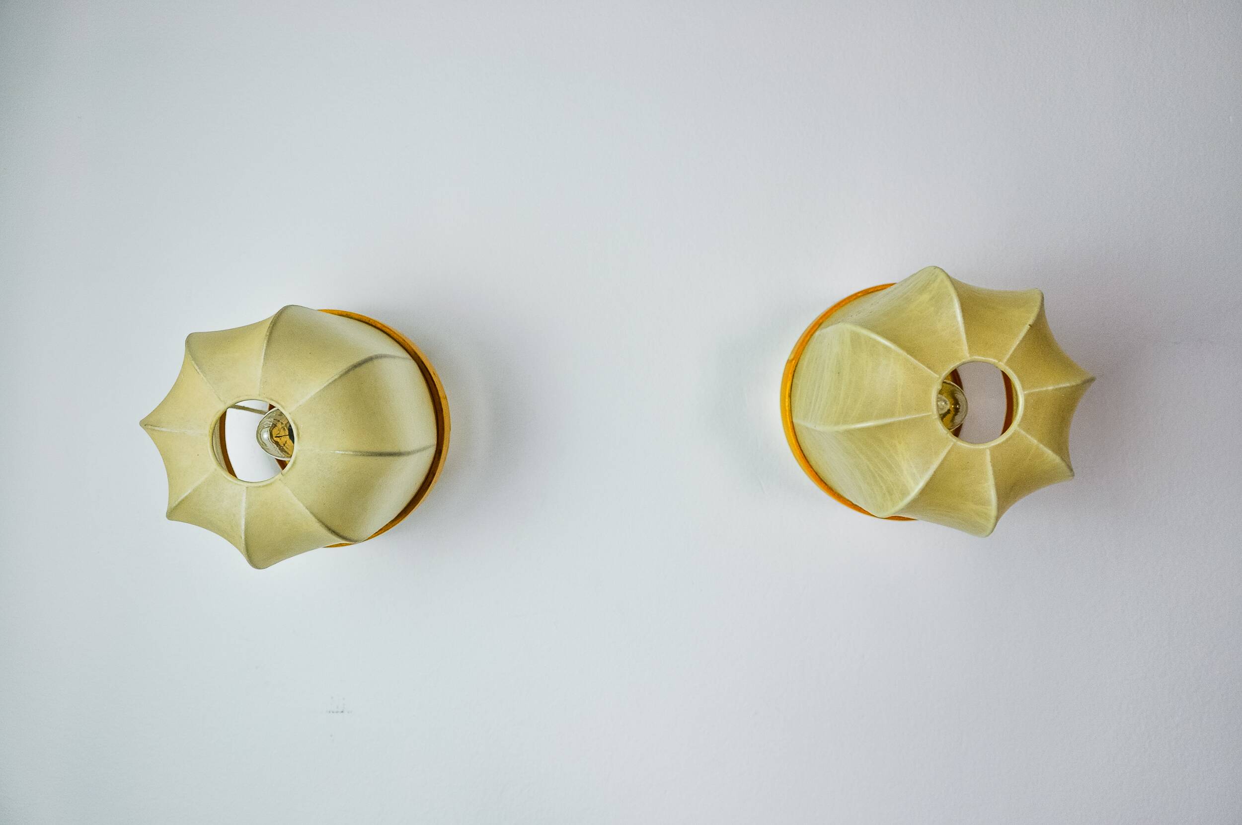 Pair of "cocoon" wall lights, resin and pine, Italy, 1970
