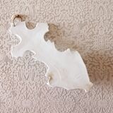 Antique holy water font in white porcelain biscuit.