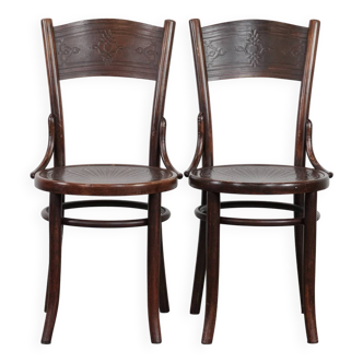 Set of two timeless vintage wooden Cosmos bistro design chairs