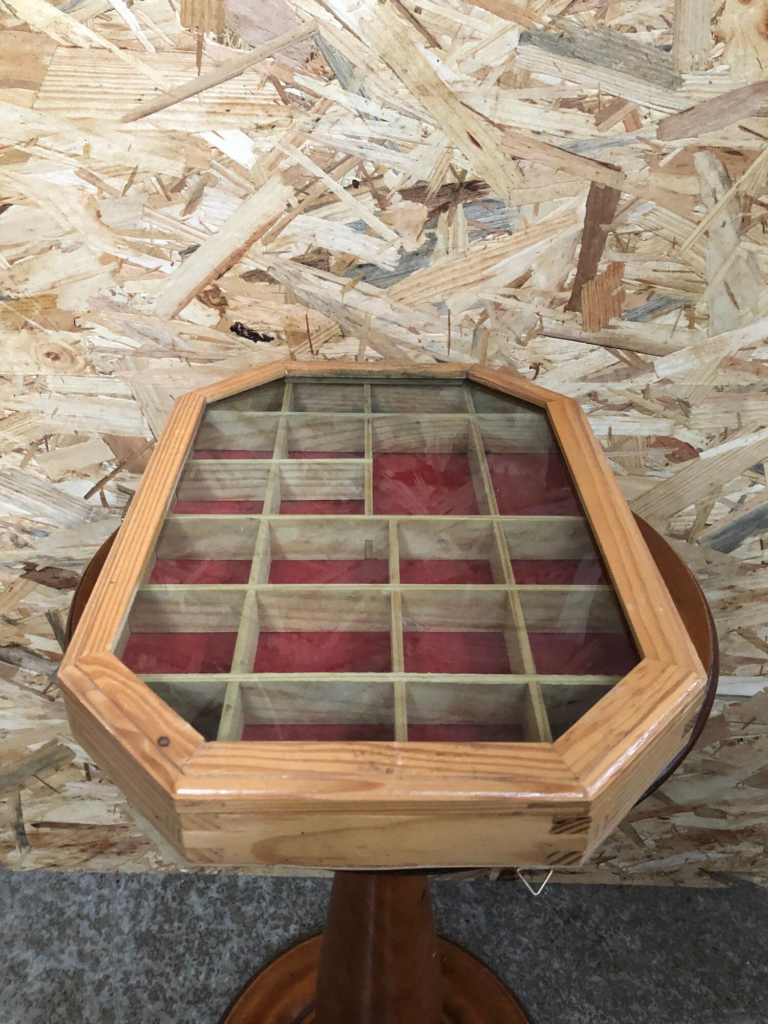 Old hanging showcase 22 wooden boxes red background