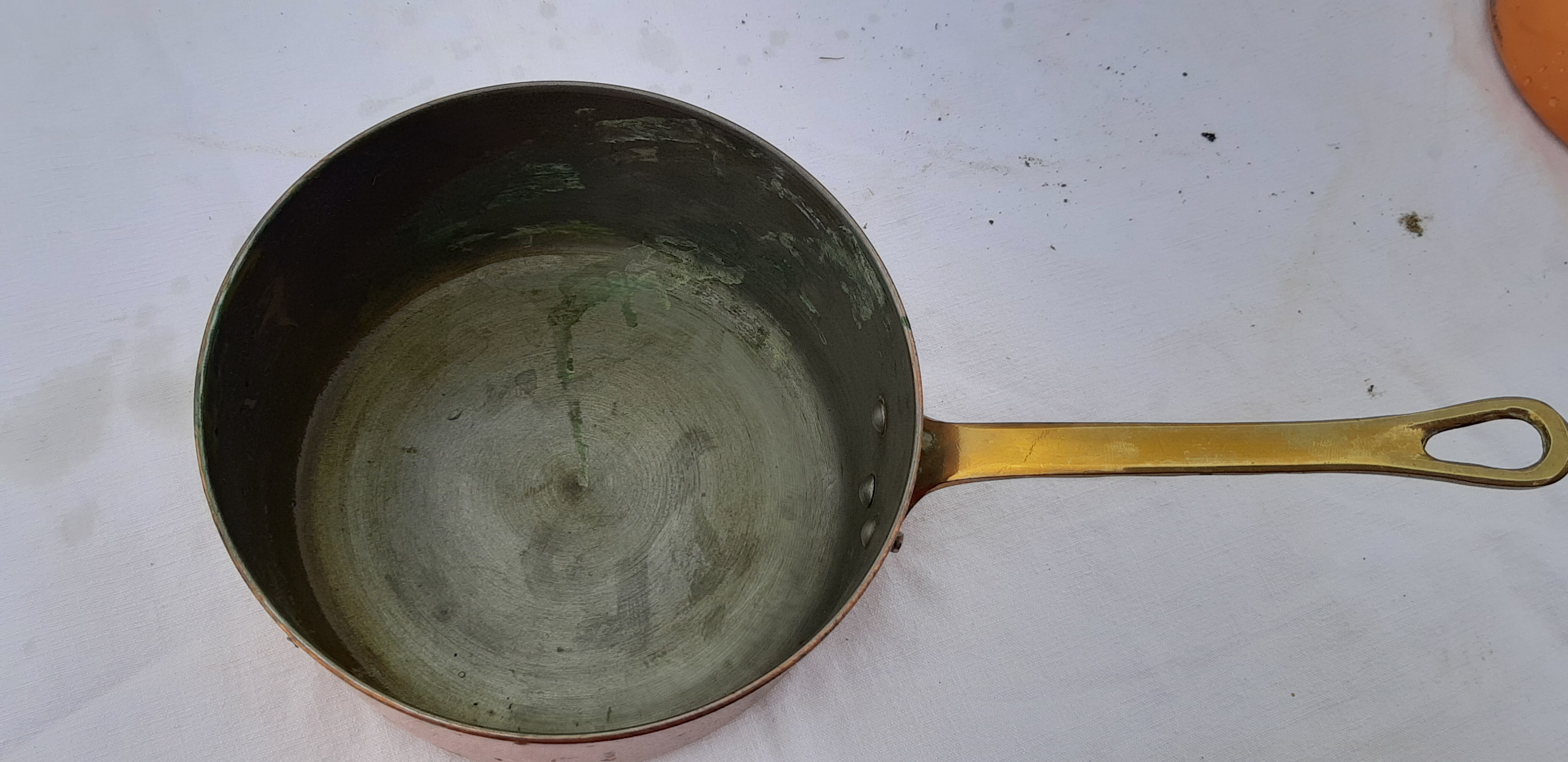 Lots of tinned copper kitchen utensils