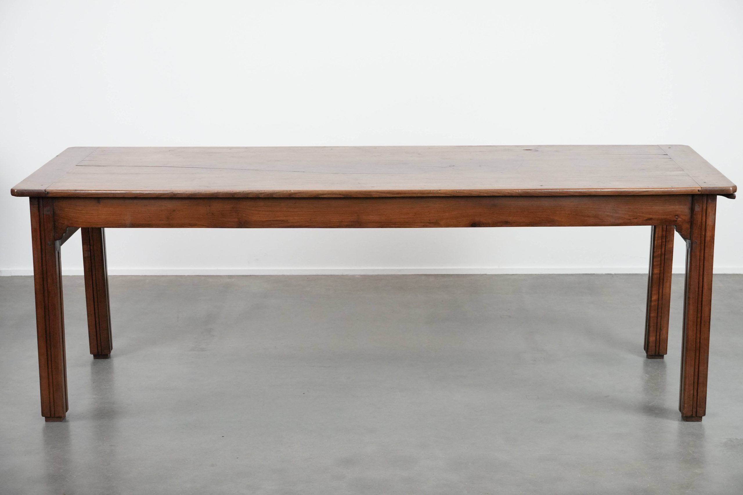 Antique French farmhouse dining table with two drawers and a pull-out board